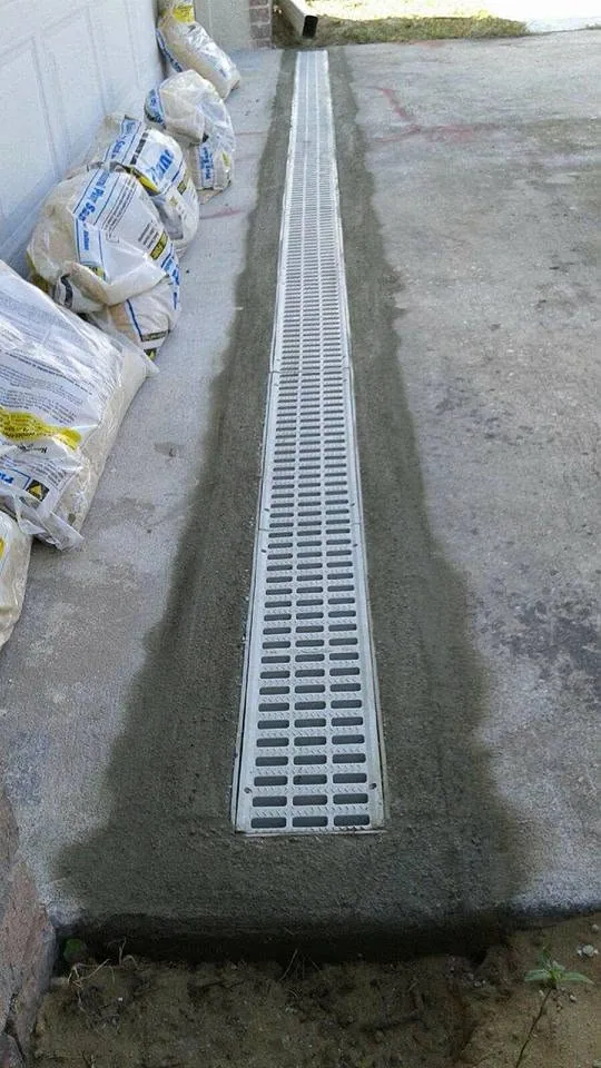 Trench drain grate garage apron fresh concrete, Sanford